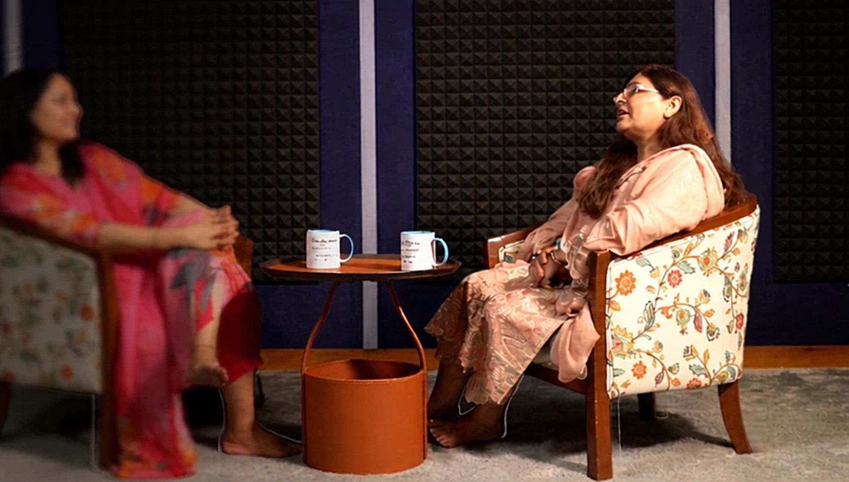 Two members on the podcast set