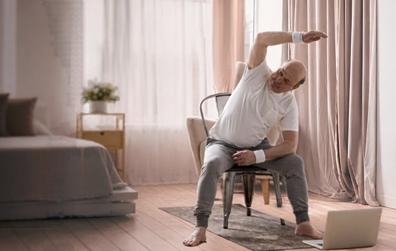 A member doing gentle stretches at home